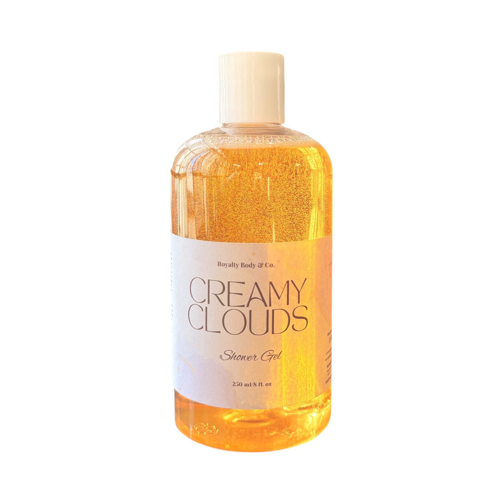 The Royally Body & Co. Creamy Clouds Shower Gel for sensitive skin comes in a clear 250 ml (8 fl oz) bottle with a white cap. The shower gel is golden orange and enriched with vegetable glycerin.